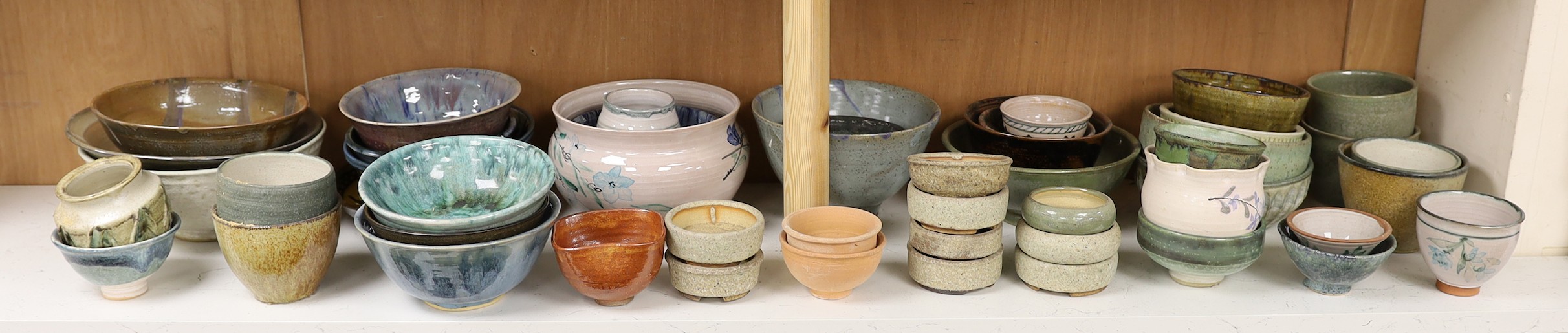 A large quantity of British studio pottery bowls and dishes, to include a vast amount by Susan Threadgold